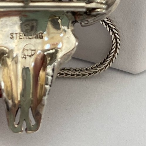 bull steer skull and feather mark in sterling